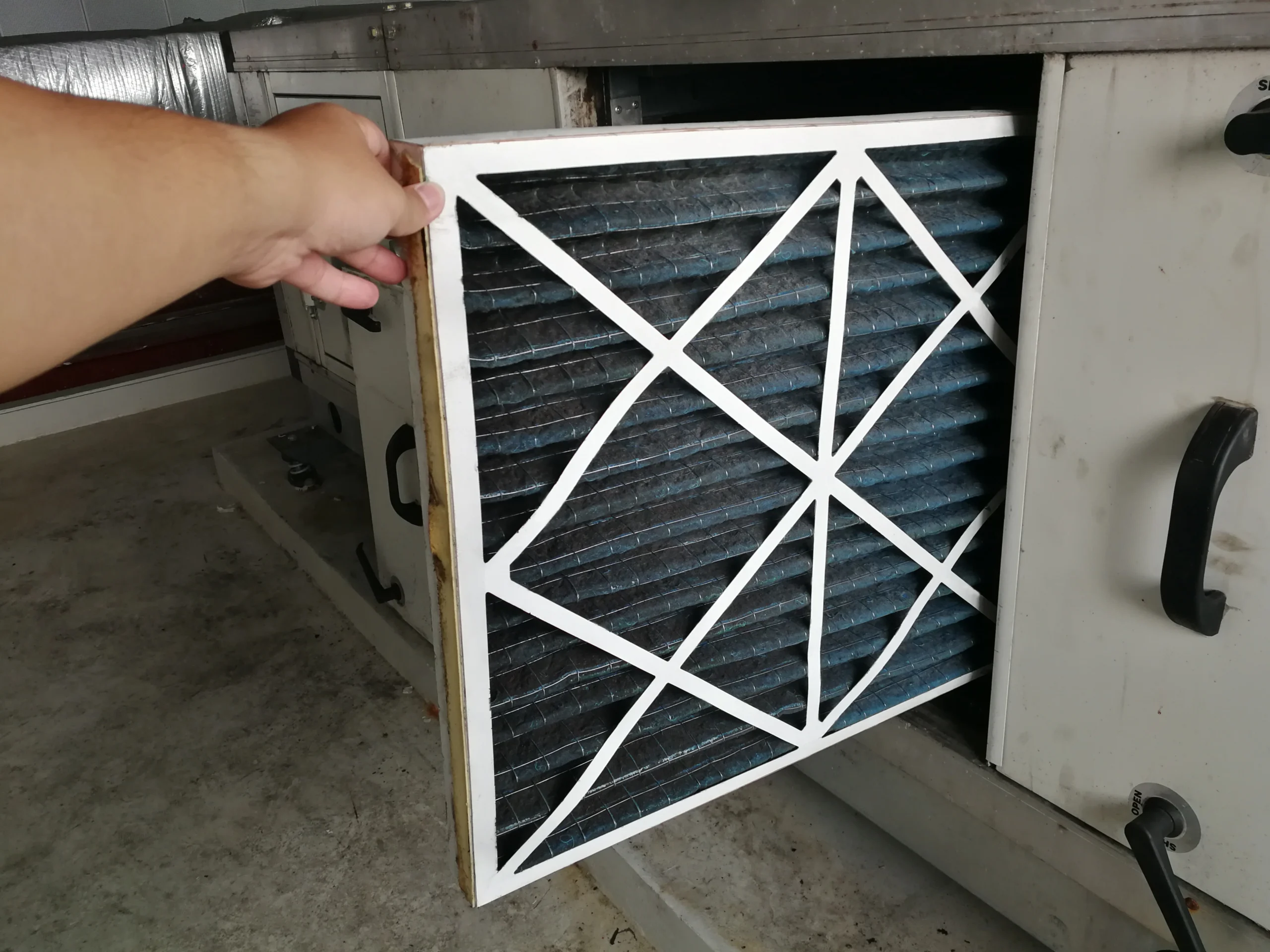 Changing furnace filter in a residential furnace cabinet